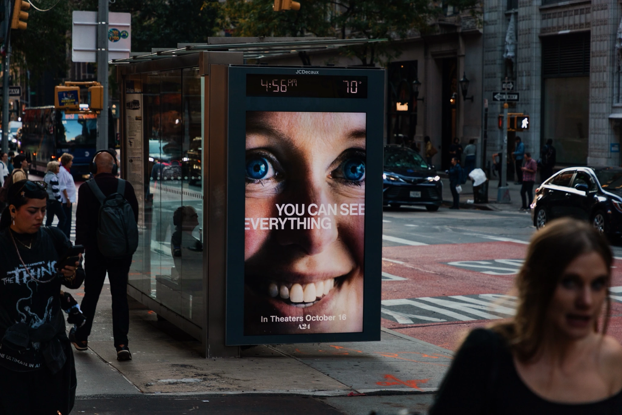 A24 You Can See Everything street furniture ad with blue eyes and the film title in New York City.