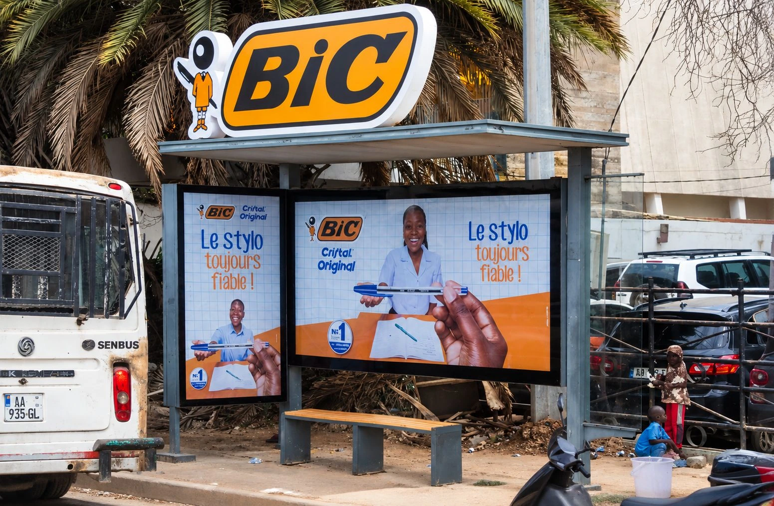 BIC Cristal Original branded bus shelter in Dakar with large illuminated BIC logo and campaign panels.