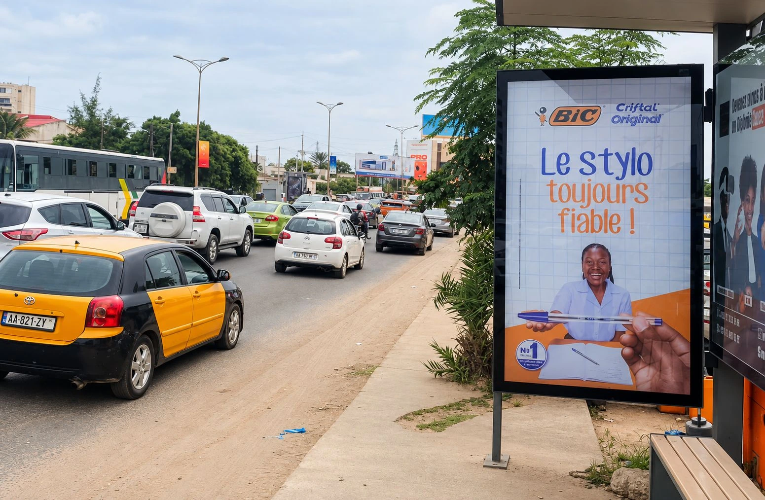 BIC Cristal Original street furniture ad beside busy traffic in Dakar.