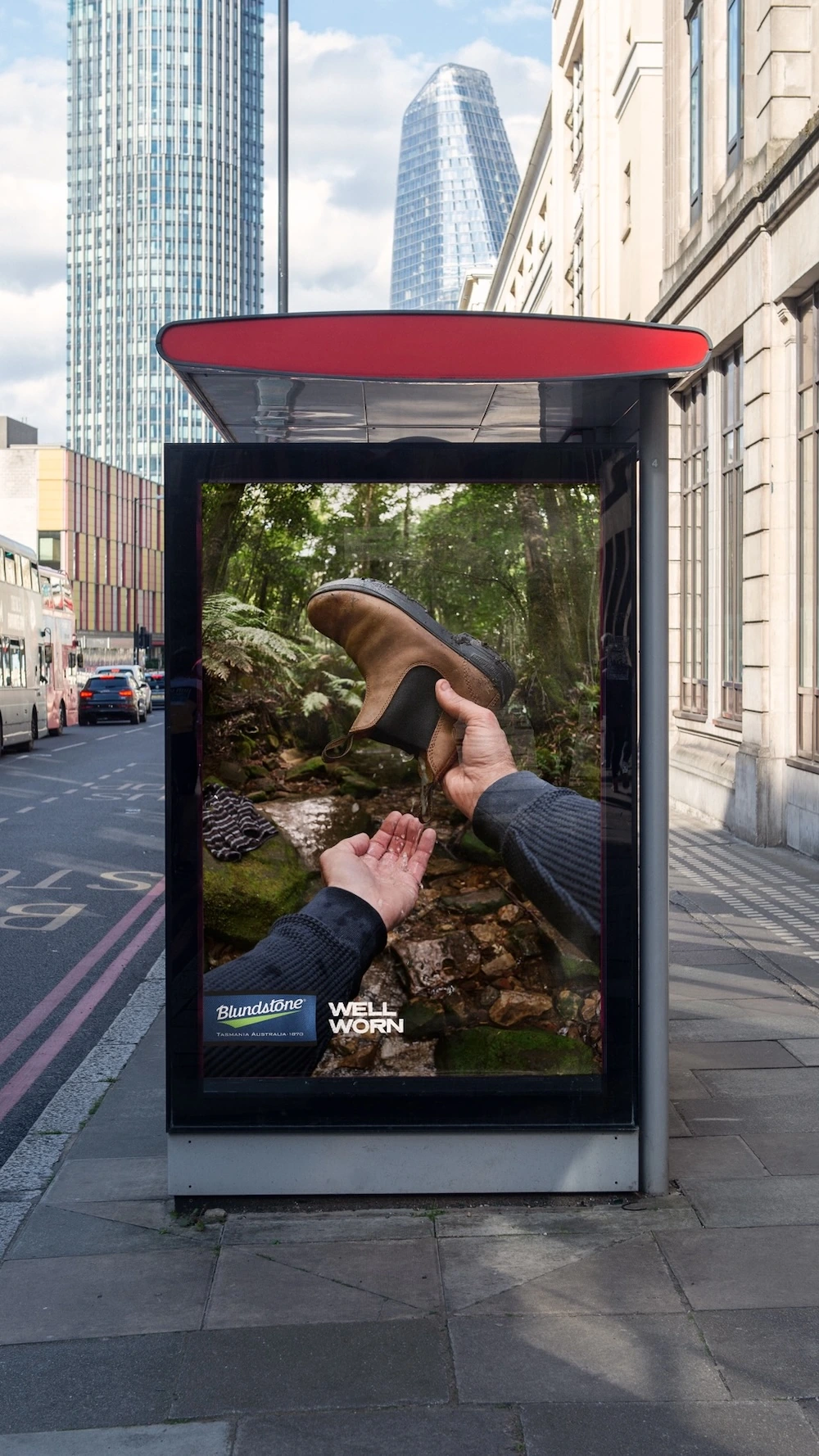 Blundstone Well Worn bus shelter creative showing a brown boot held over a forest stream.