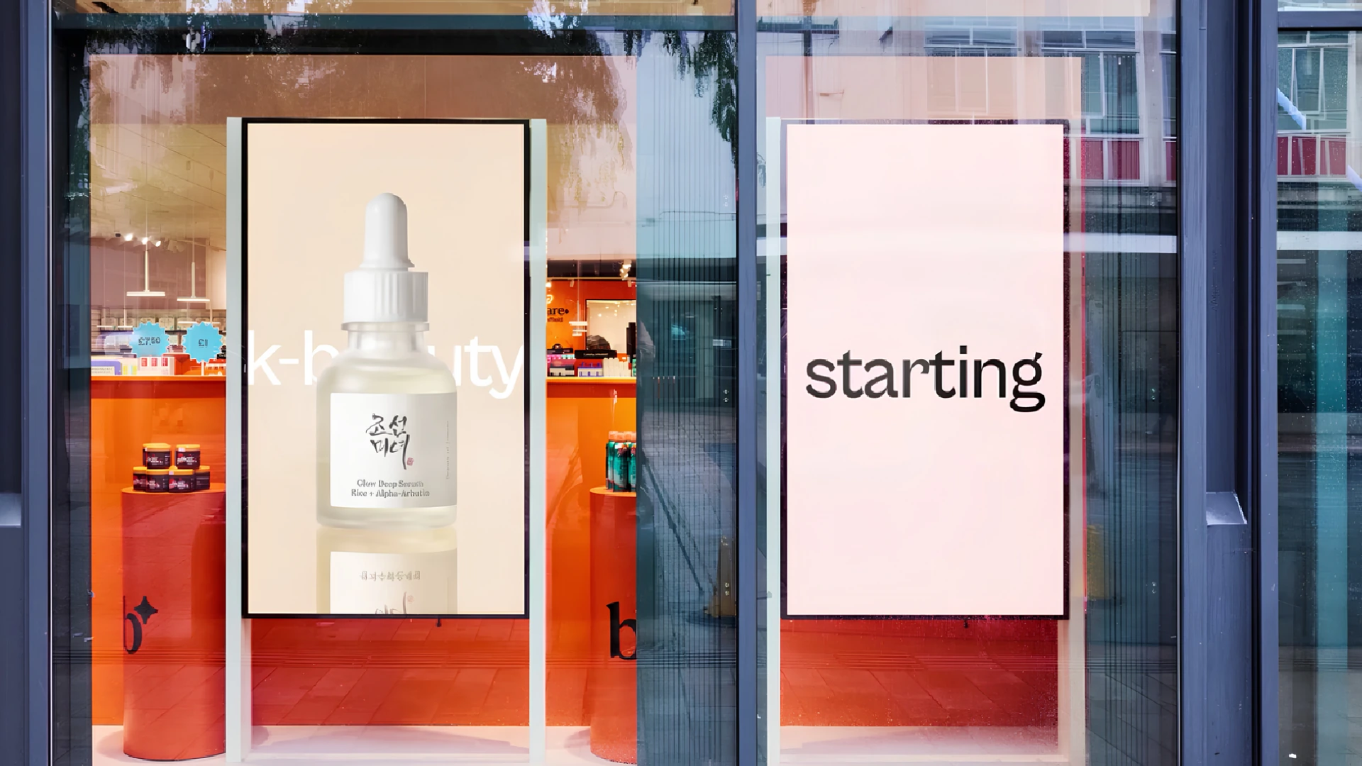 Bodycare store window with digital screens promoting K-beauty products as part of the retailer’s new social-first brand experience.
