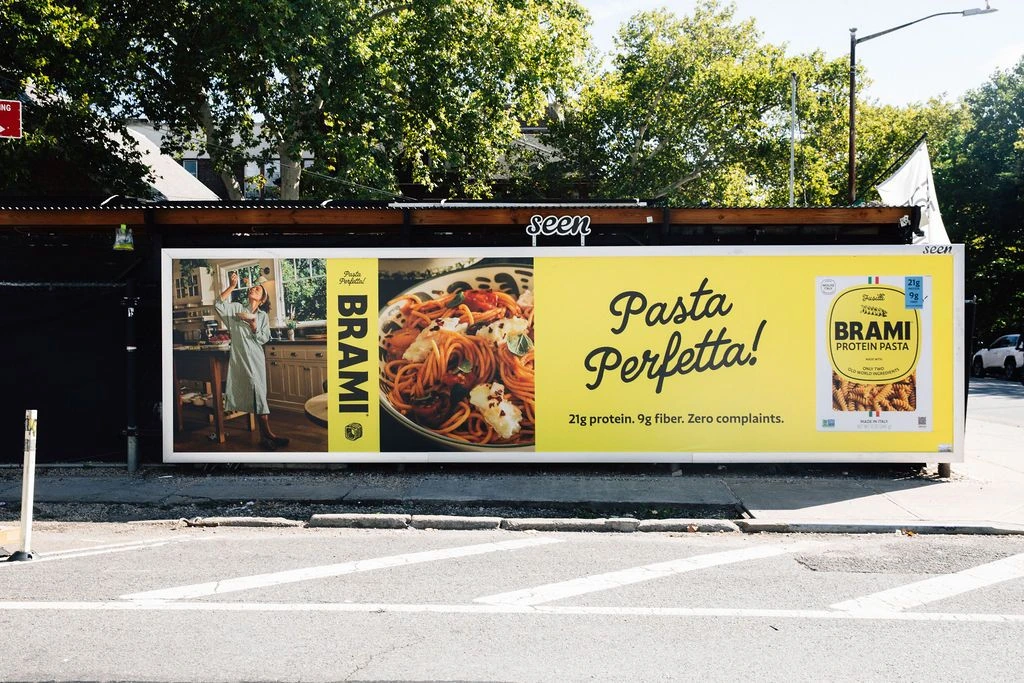 Brami Pasta Perfetta street billboard featuring a pasta meal and product packaging.