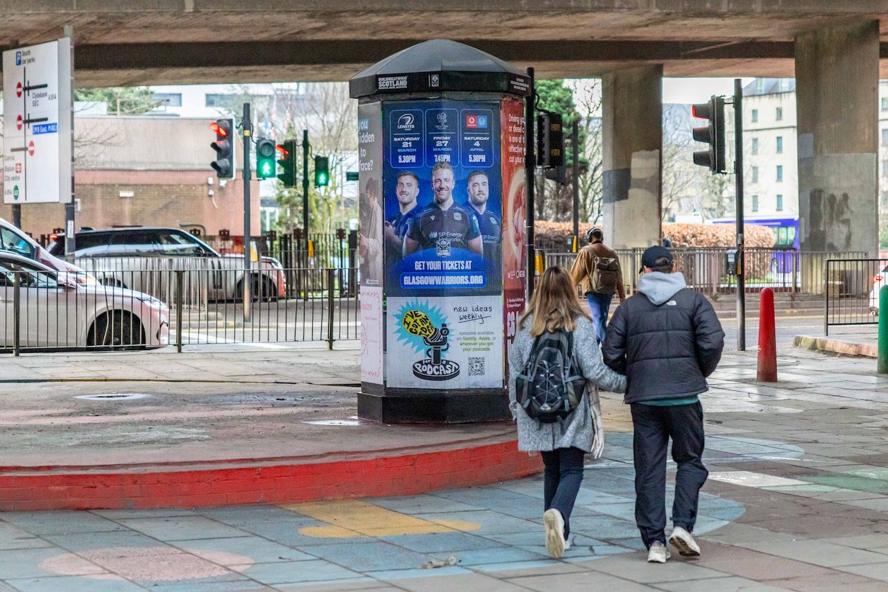 Outdoor advertising pillar in Glasgow featuring sports campaign