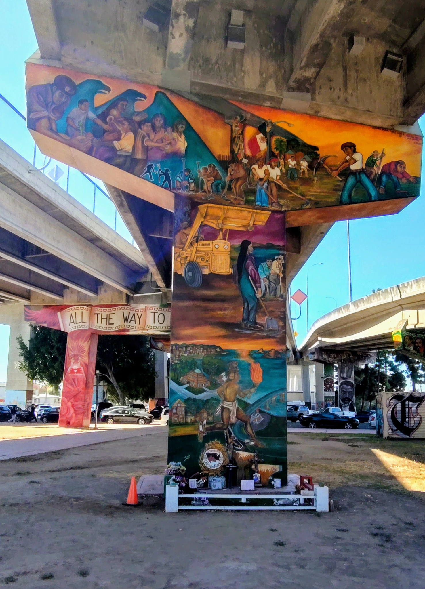 Chicano Park murals painted across freeway support columns beneath the San Diego-Coronado Bridge.