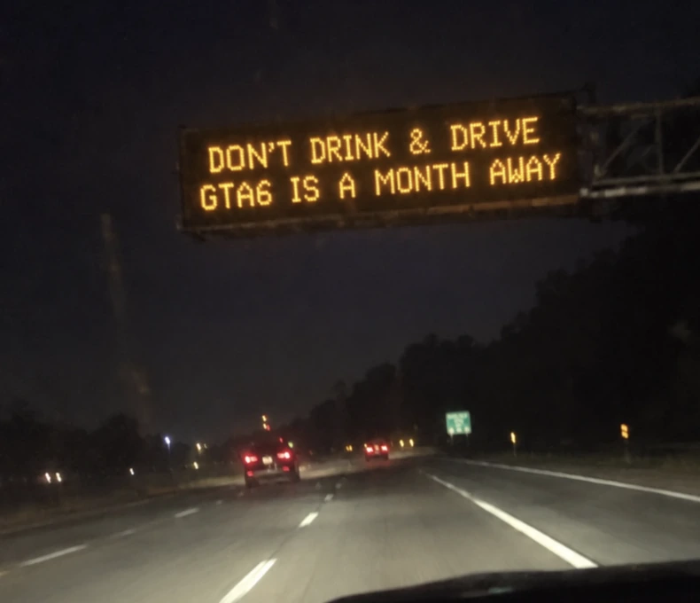 Miami highway electronic sign reading Don’t Drink and Drive, GTA 6 is a month away.