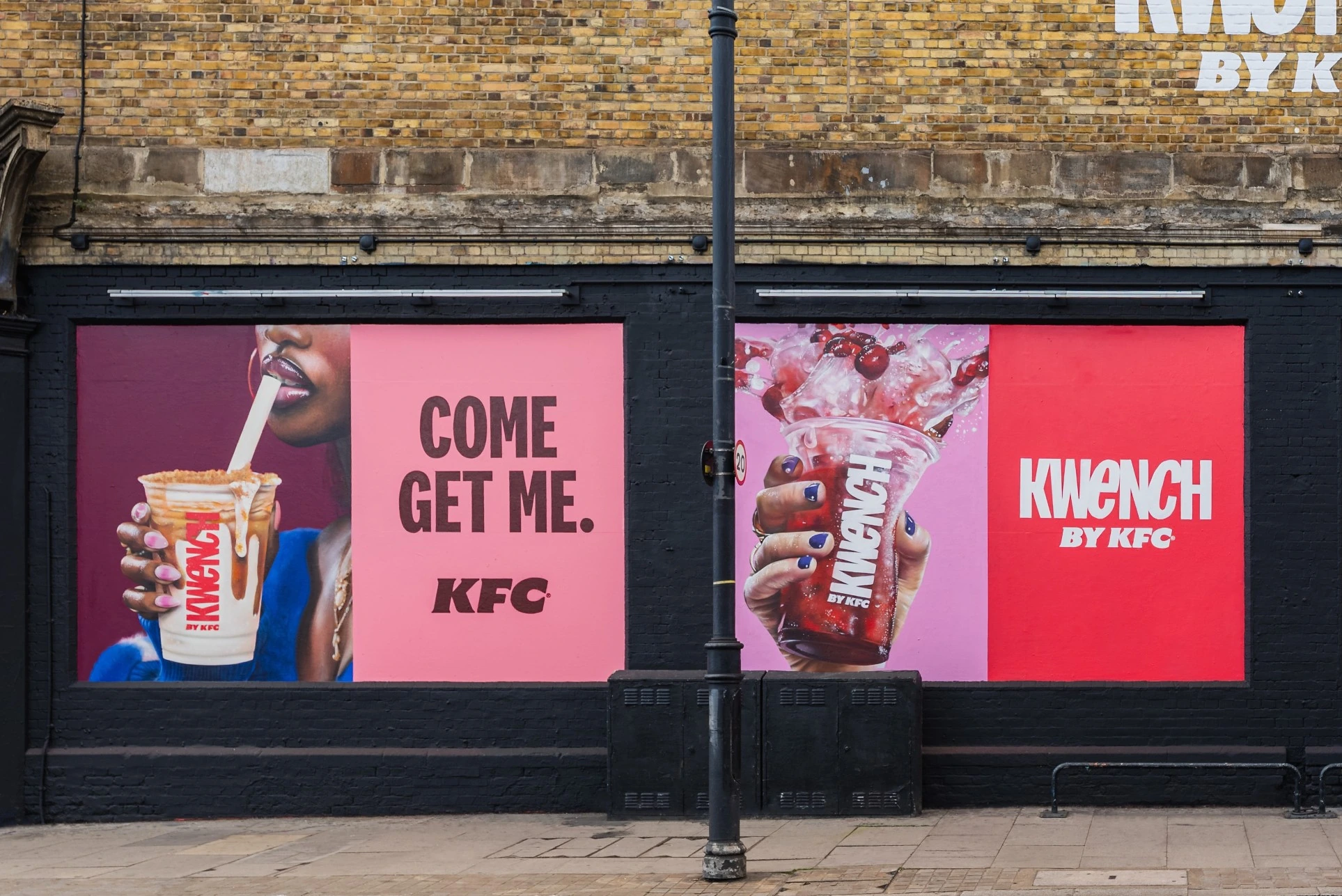 Close-up of the KFC Kwench wall on the Great Eastern Art wall in Shoreditch showing bright pink panels, drink photography and the line Come Get Me.
