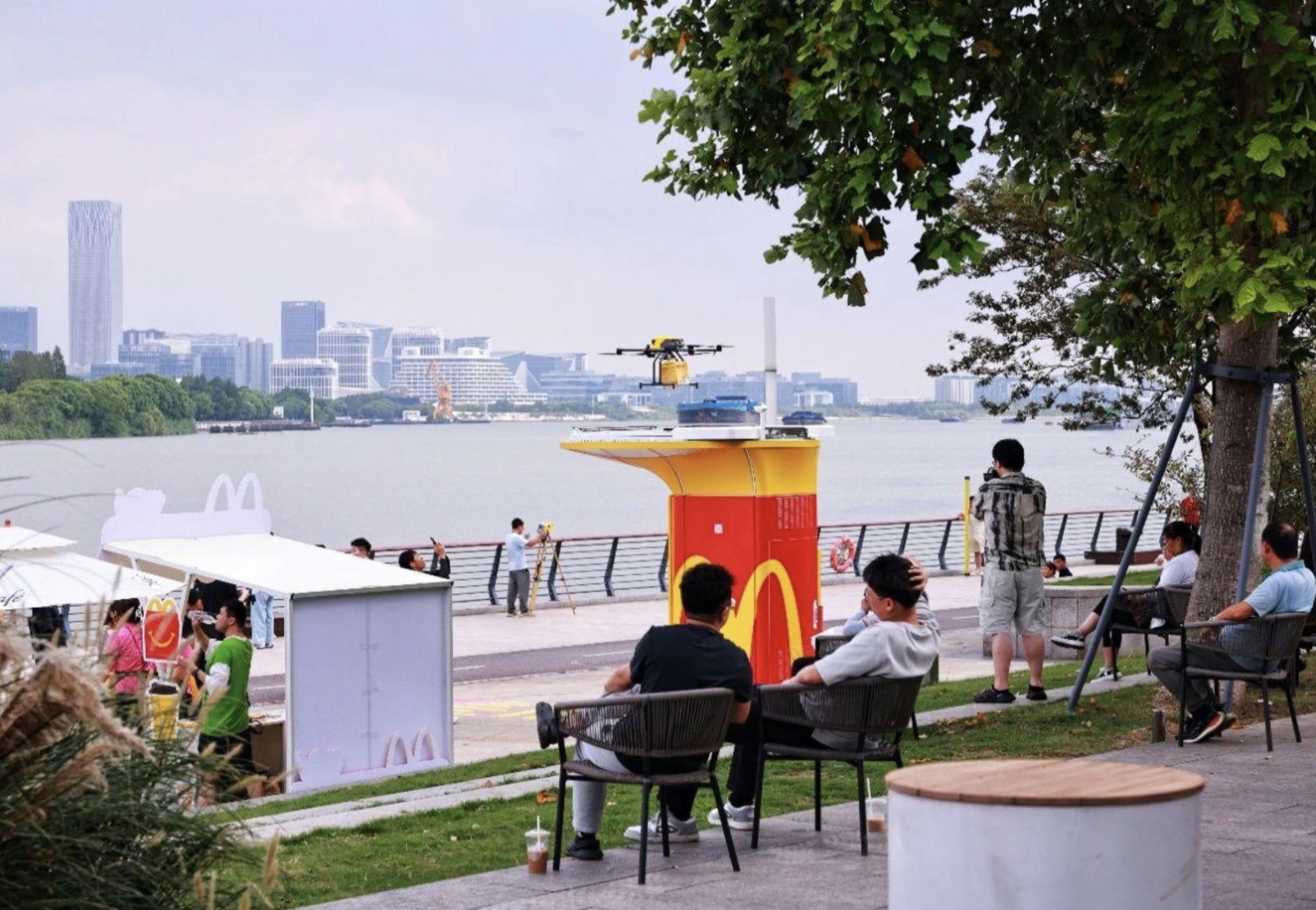Drone approaching a McDonald’s kiosk along Shanghai’s West Bund waterfront.