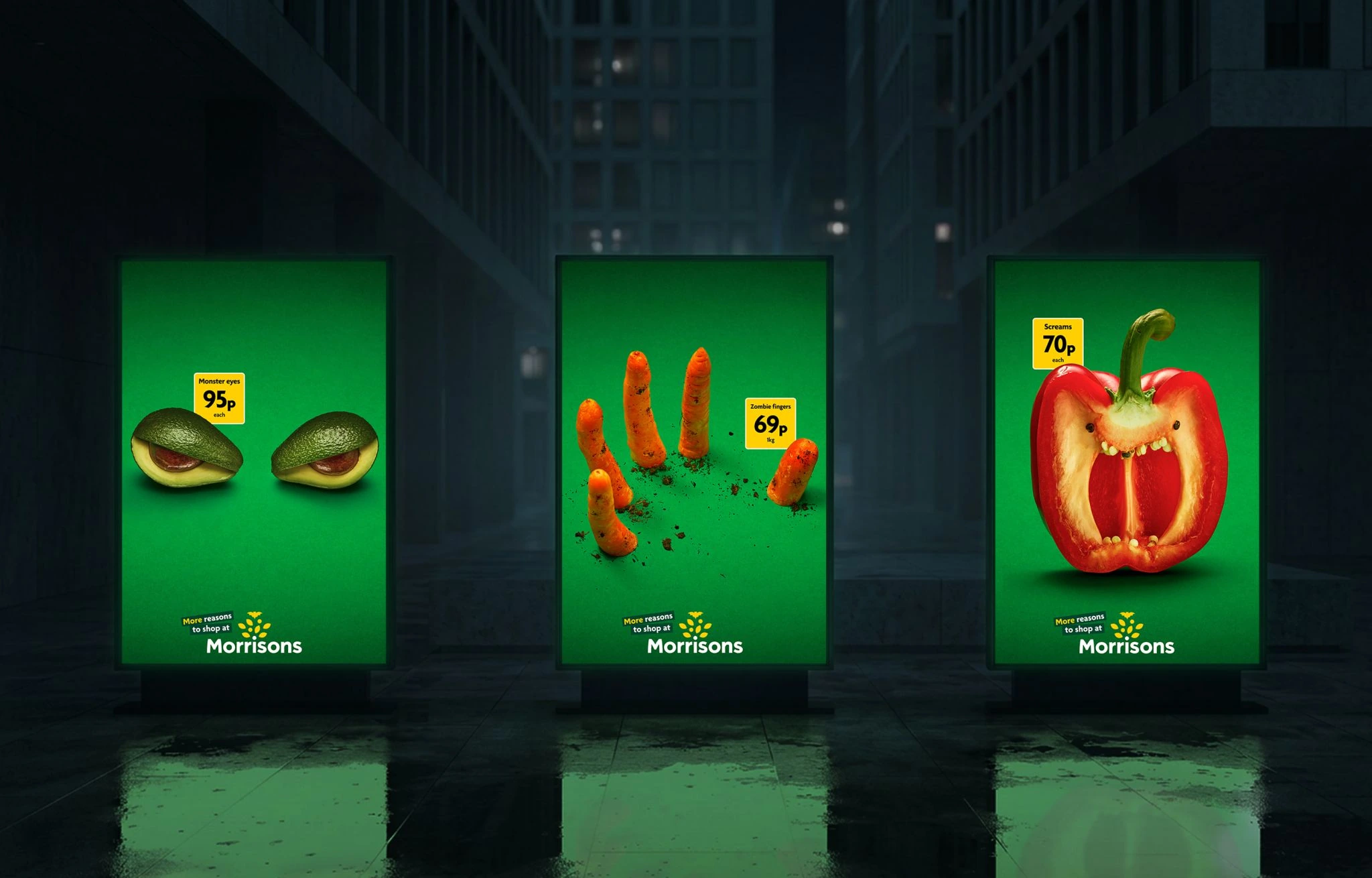 Three Halloween-themed Morrisons OOH posters showing monster eyes avocado, zombie fingers carrots and a screaming pepper on a dark city backdrop.