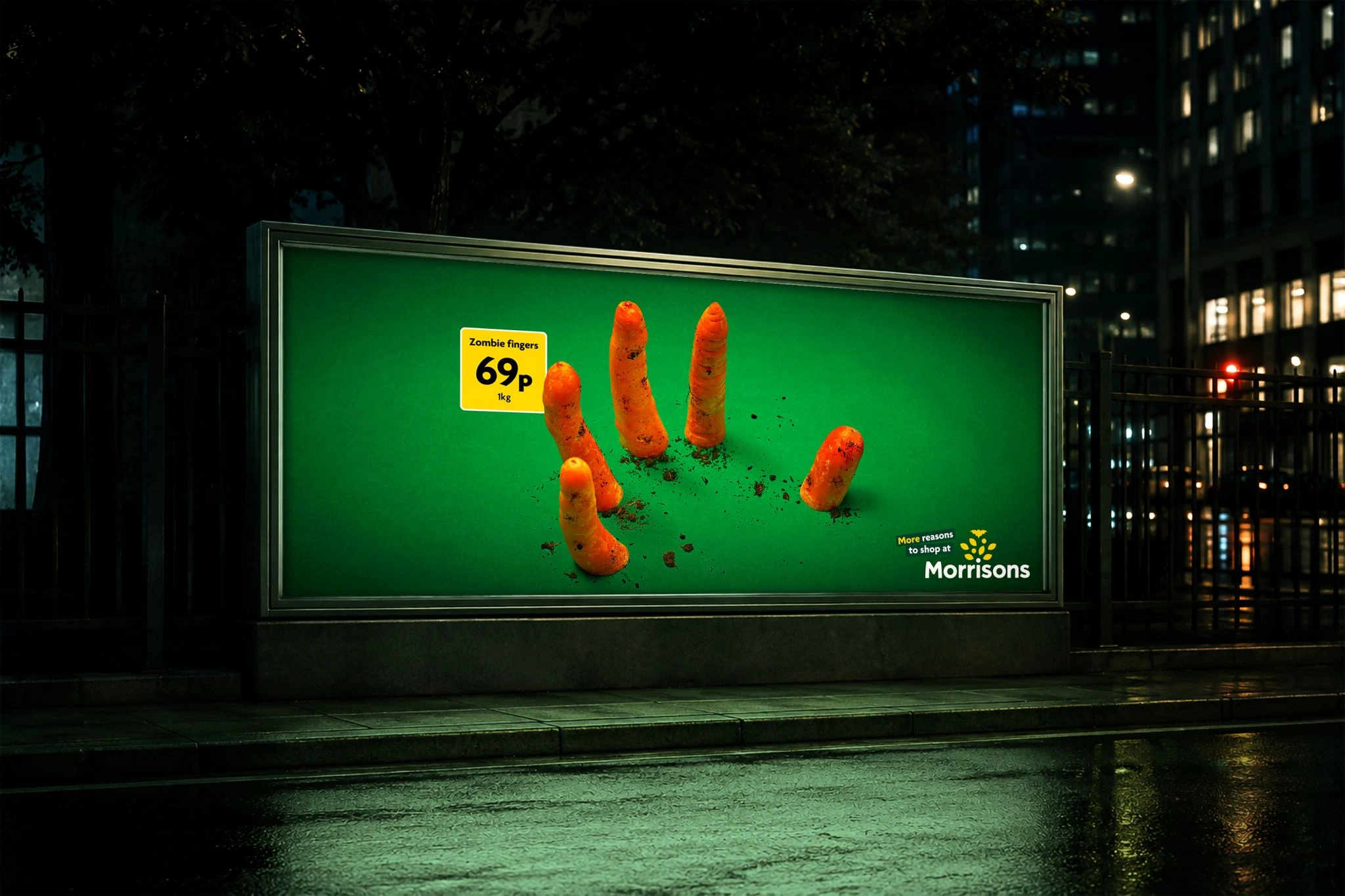 Morrisons Halloween OOH visual with carrots styled as zombie fingers reaching up from the ground against a green background.