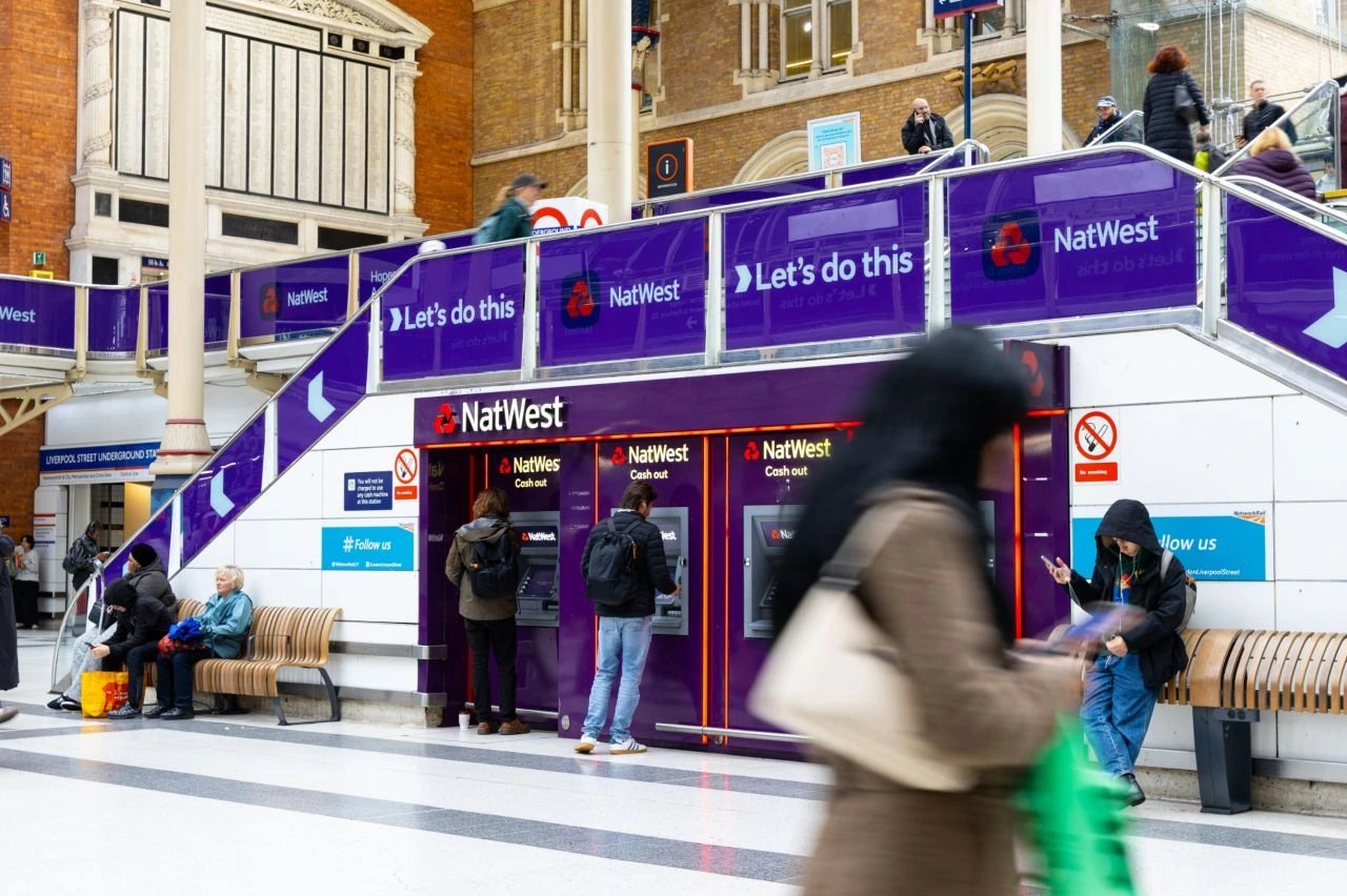 NatWest branding wrapped around the ATM area and stairway inside London Liverpool Street station as part of the Let’s do this OOH campaign.