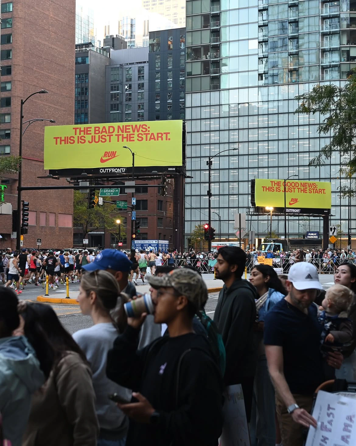 Two Nike Running billboards along the Chicago Marathon route reading The Bad News: This Is Just the Start and The Good News: This Is Just the Start.