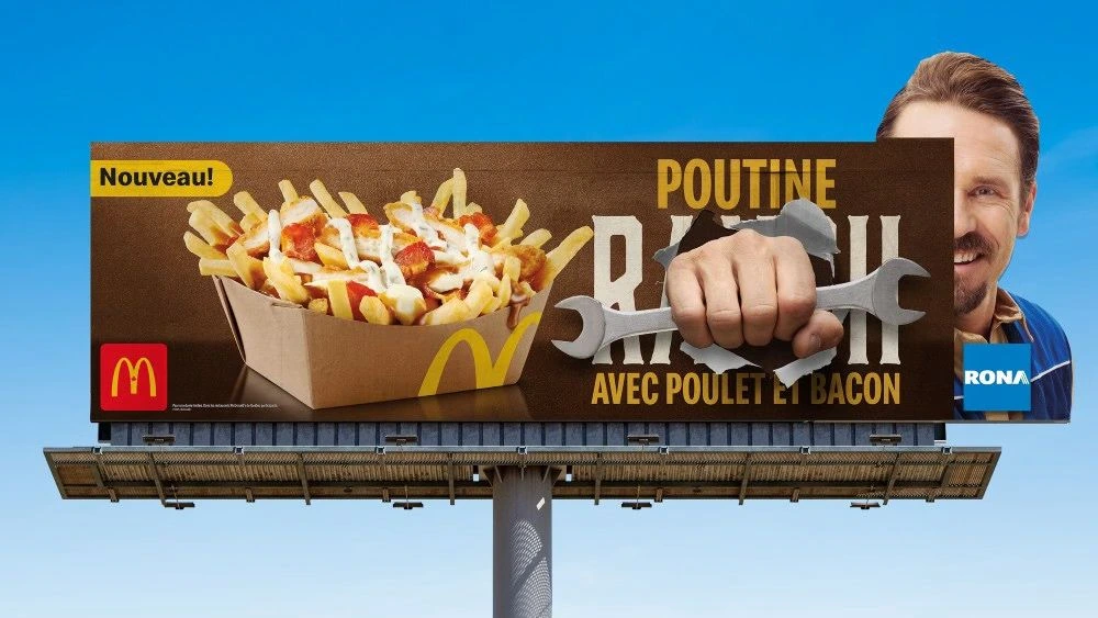 Billboard combining McDonald’s poutine advertising with a RONA repairman visual and wrench.
