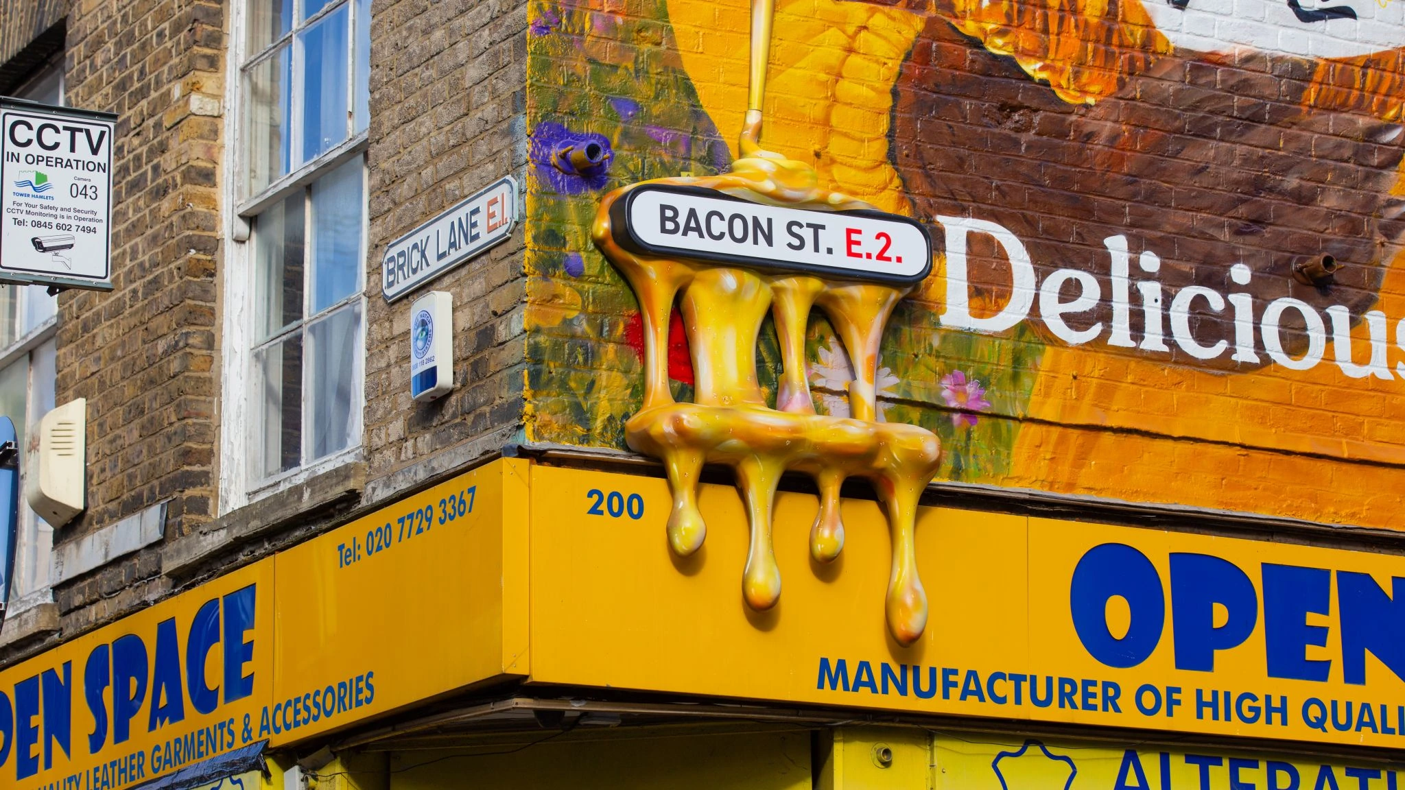 Bacon Street sign covered with a 3D dripping honey installation for Rowse in Shoreditch.