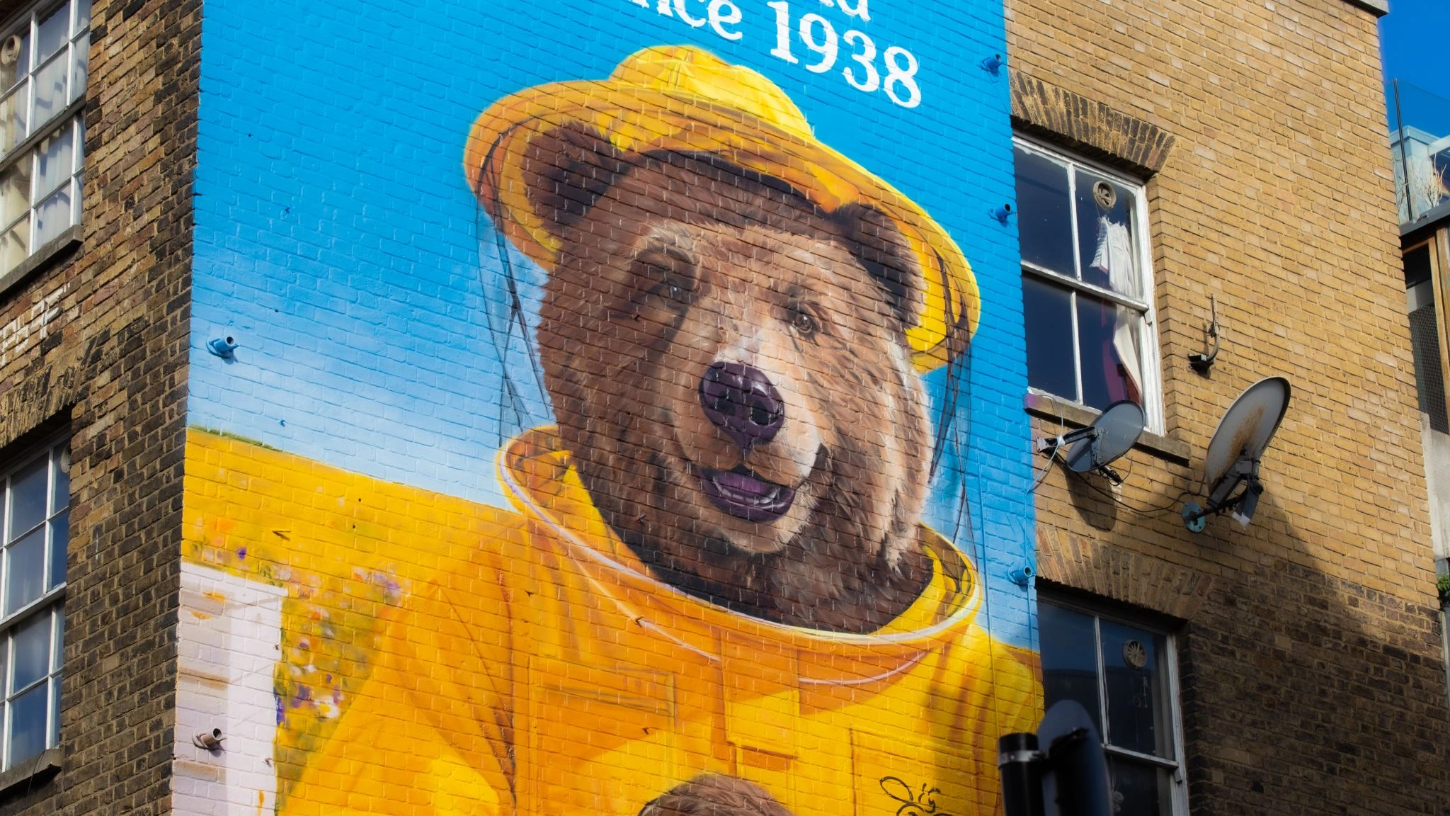 Close view of Rowse honey bear character painted on a large Shoreditch mural.