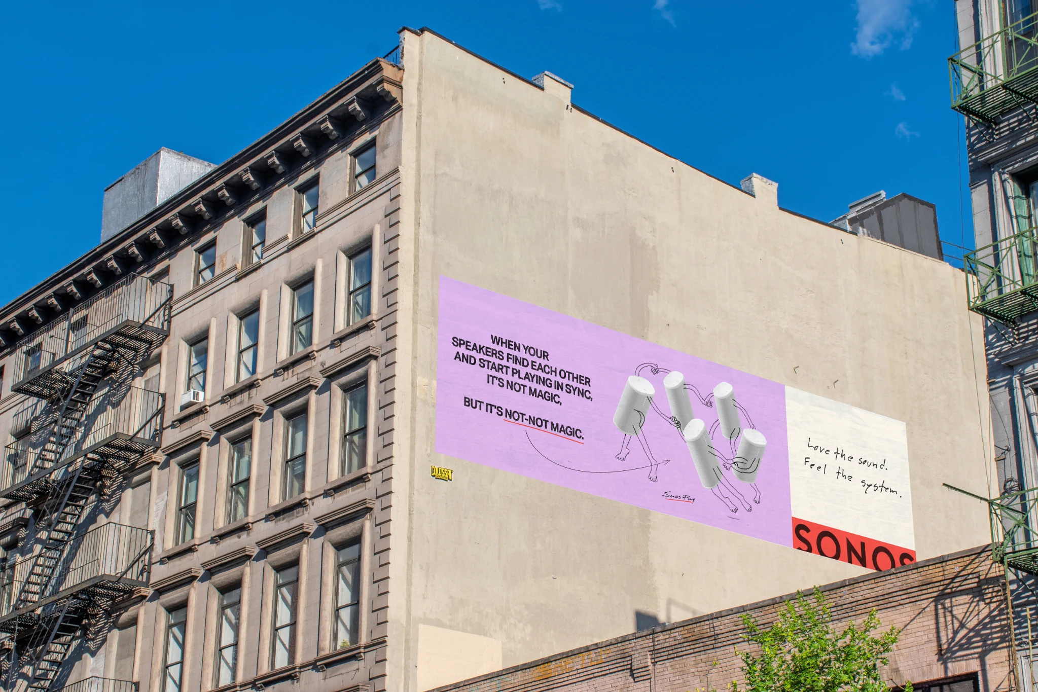 Large Sonos wall advertisement in New York showing illustrated connected white speakers on a purple background with the line When your speakers find each other and start playing in sync, it's not magic, but it's not-not magic.