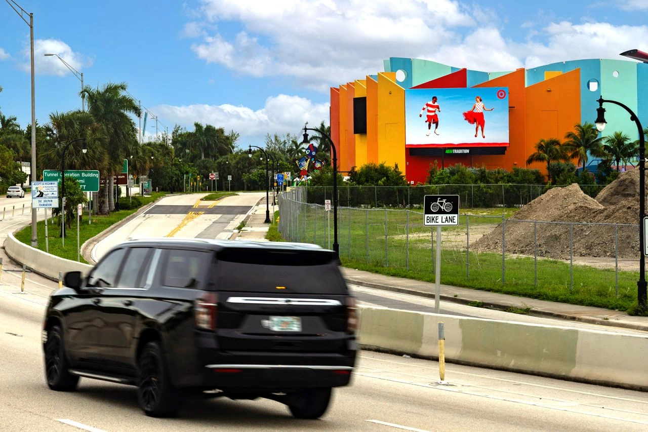 Target digital billboard in Miami showing fashion creative on a bright blue background.