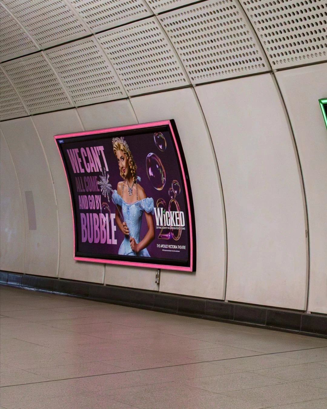 Wicked Tube poster in London featuring Glinda and the line We can't all come and go by bubble.